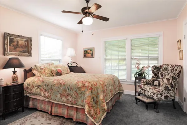 a bedroom with a bed and a couch