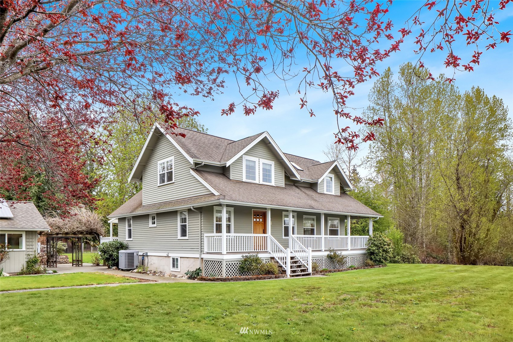 1368 Huntley Road Bellingham, WA 98226 - Photo 1 of 36 a front view of a house with a yard