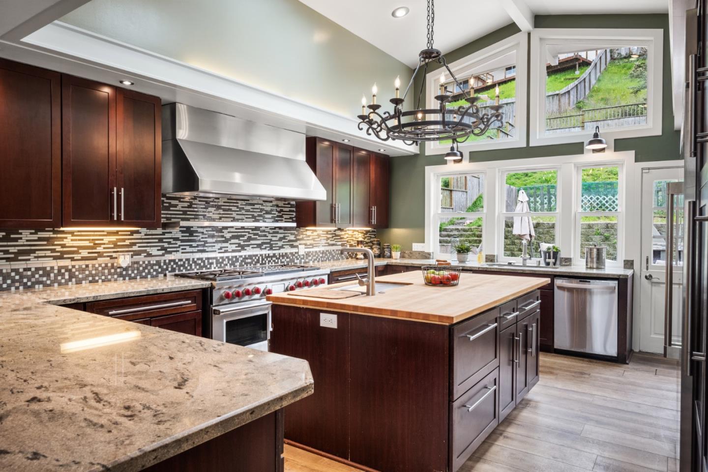 970 Park Pacifica Avenue Pacifica, CA 94044 - Photo 10 of 61 a kitchen with a stove a sink a refrigerator and a counter top space