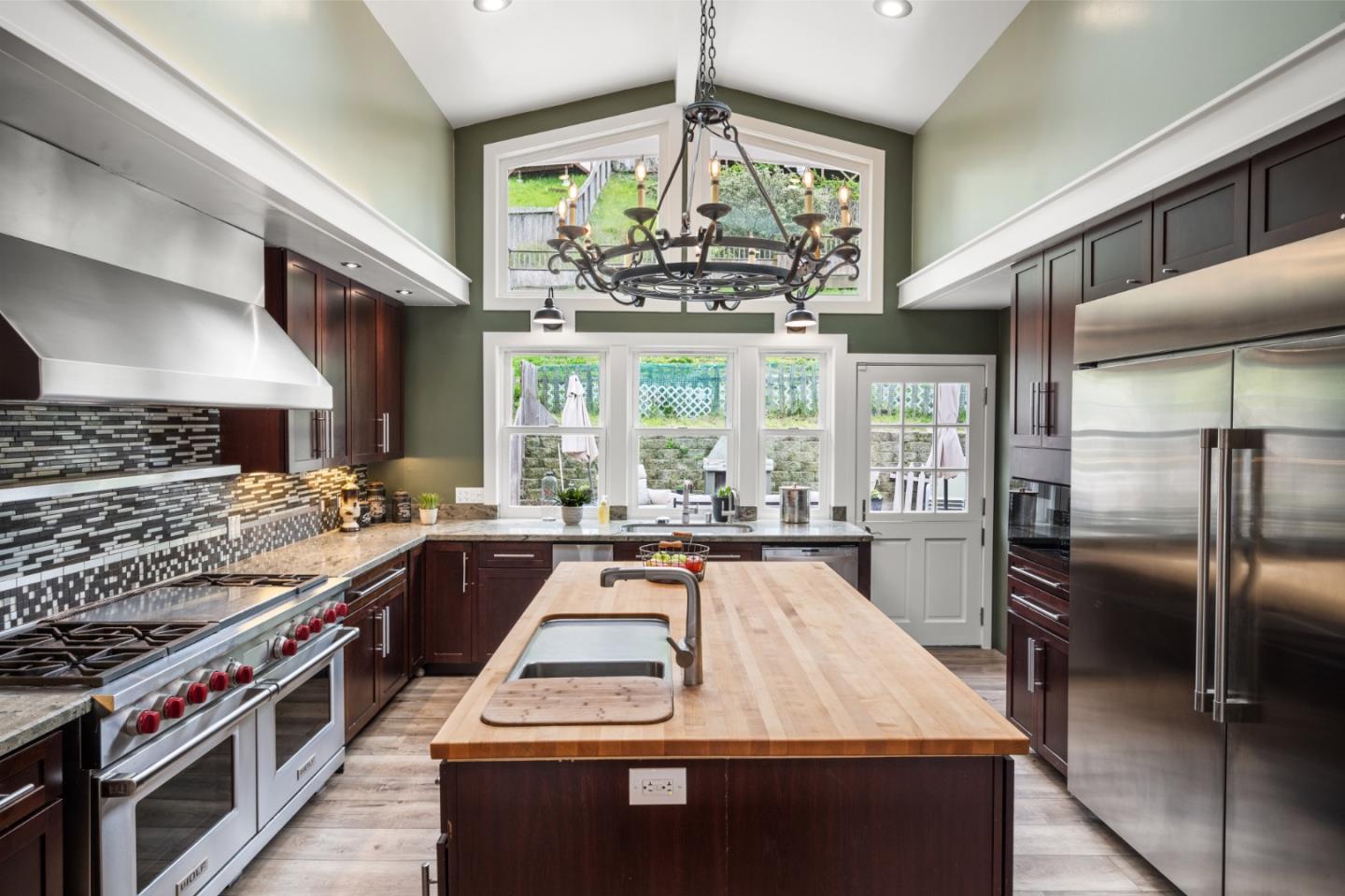 970 Park Pacifica Avenue Pacifica, CA 94044 - Photo 11 of 61 a large kitchen with stainless steel appliances granite countertop a stove and more cabinets