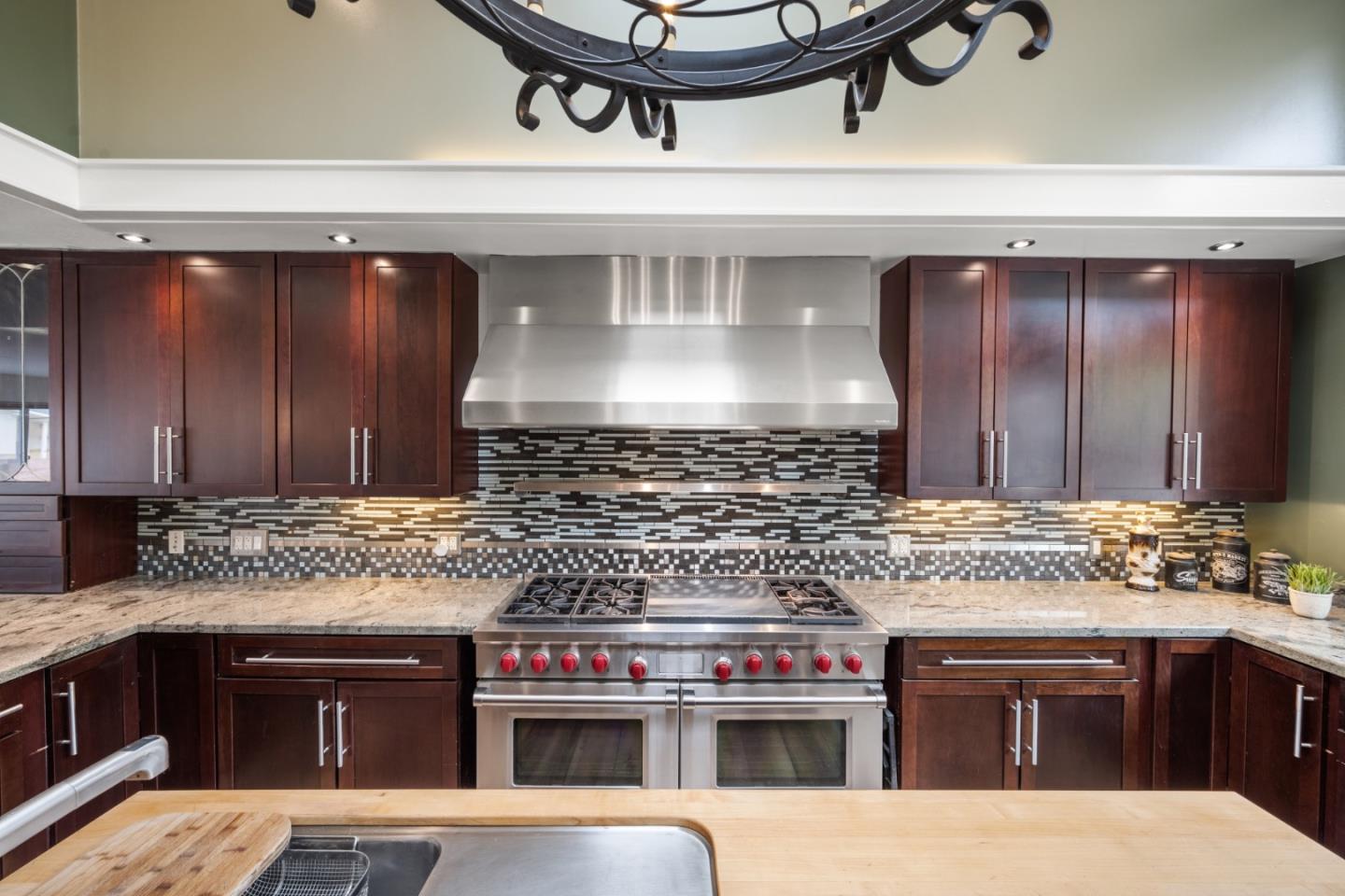 970 Park Pacifica Avenue Pacifica, CA 94044 - Photo 13 of 61 a kitchen with stainless steel appliances a stove and cabinets