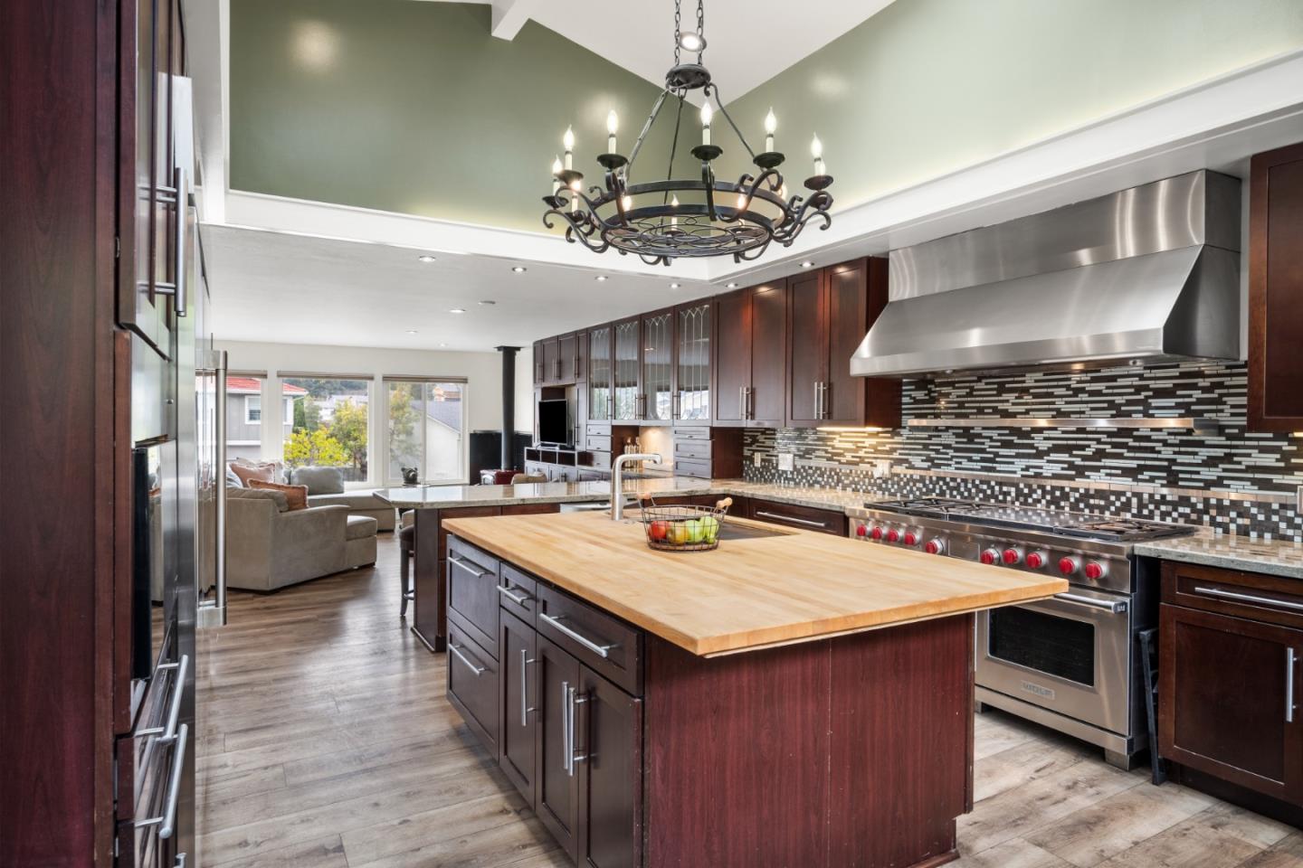 970 Park Pacifica Avenue Pacifica, CA 94044 - Photo 14 of 61 a kitchen with a stove a counter space a sink and cabinets