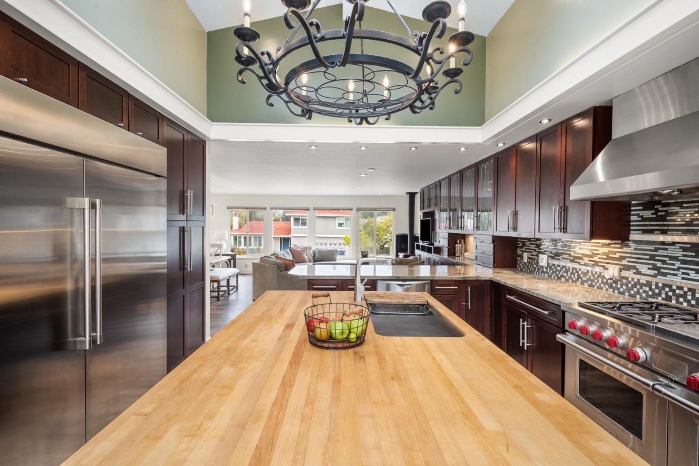 970 Park Pacifica Avenue Pacifica, CA 94044 - Photo 16 of 61 a kitchen with stainless steel appliances granite countertop a sink a stove and a refrigerator