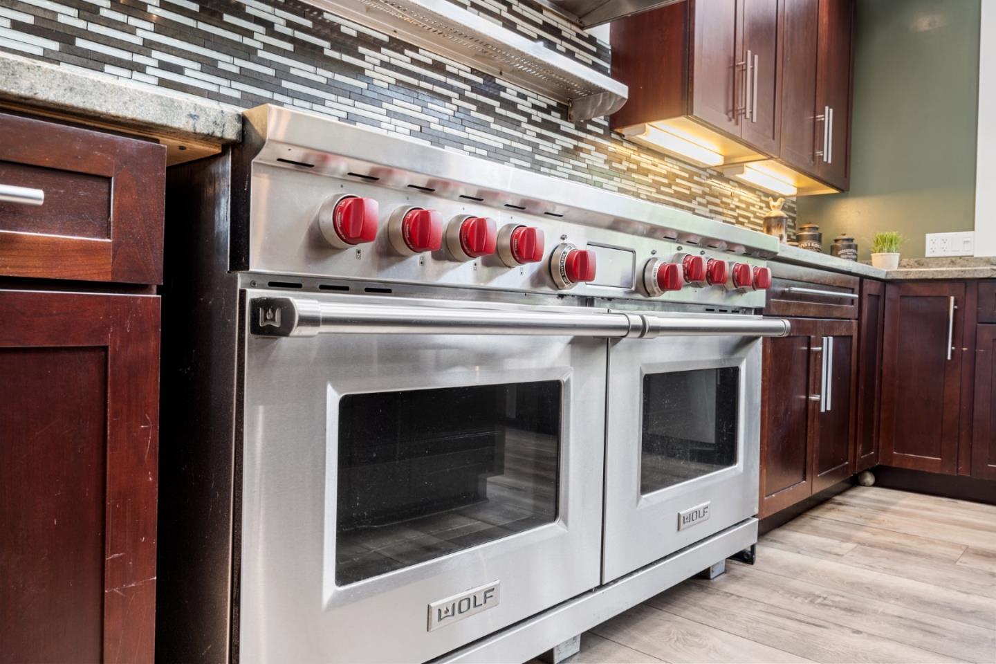 970 Park Pacifica Avenue Pacifica, CA 94044 - Photo 17 of 61 a stove top oven sitting inside of a kitchen