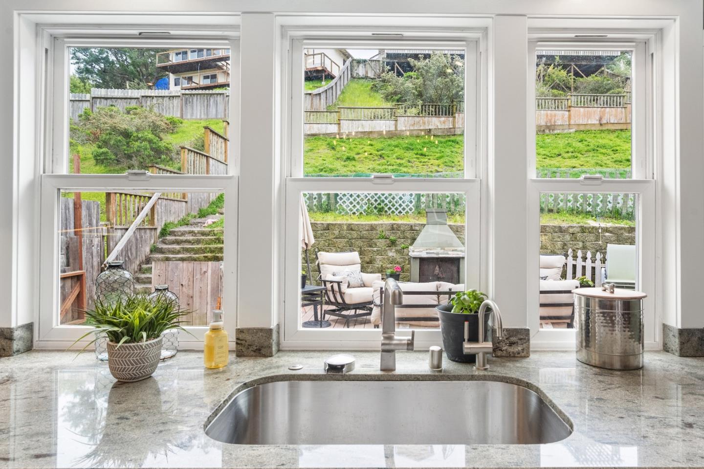 970 Park Pacifica Avenue Pacifica, CA 94044 - Photo 23 of 61 a view of living room with a large window and dining table