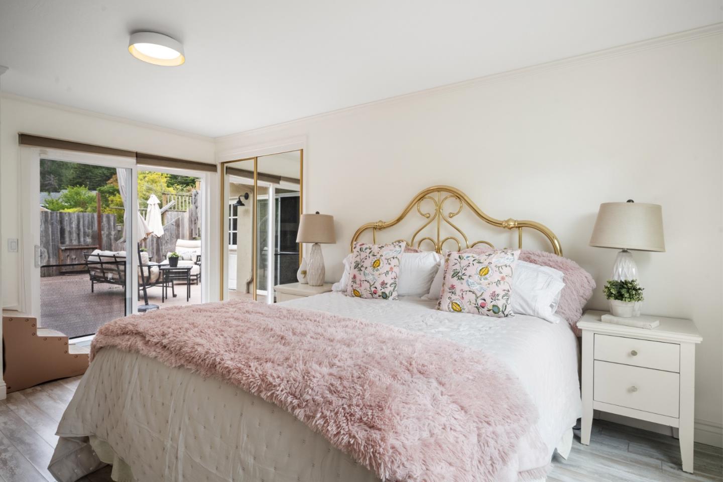 970 Park Pacifica Avenue Pacifica, CA 94044 - Photo 24 of 61 a bedroom with a large bed and a window