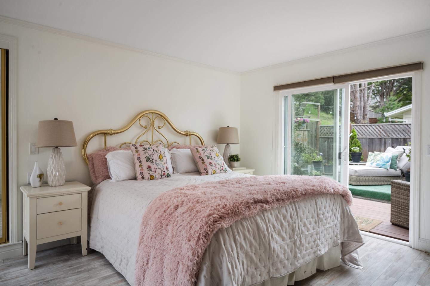 970 Park Pacifica Avenue Pacifica, CA 94044 - Photo 26 of 61 a bedroom with a bed and large window