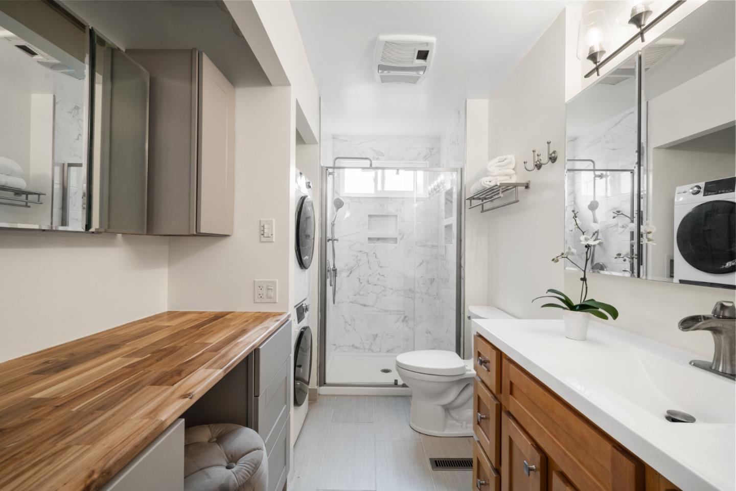 970 Park Pacifica Avenue Pacifica, CA 94044 - Photo 27 of 61 a bathroom with a sink a toilet a mirror and shower