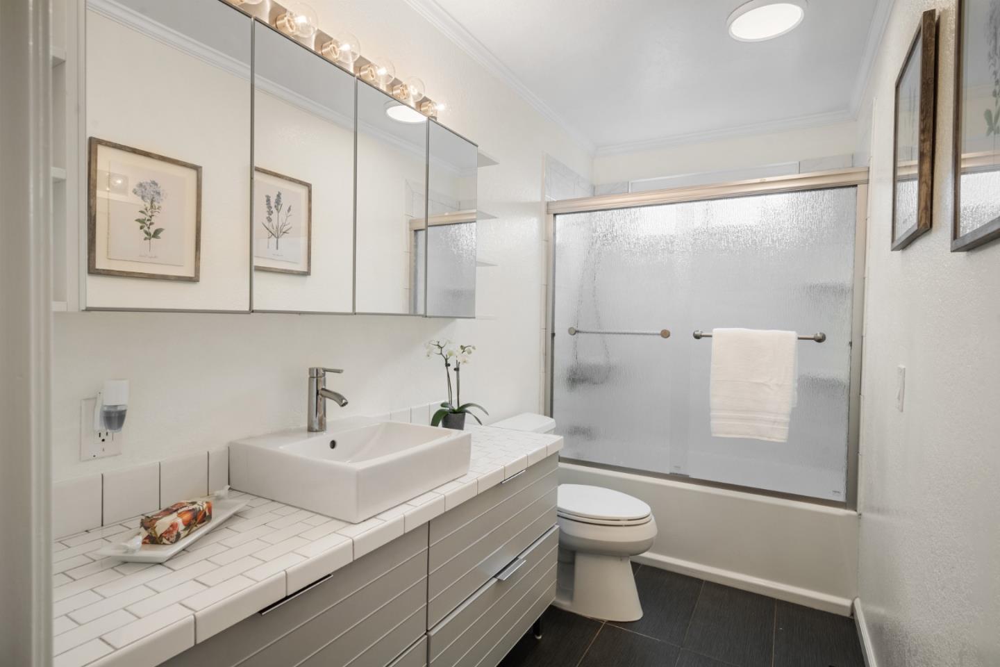 970 Park Pacifica Avenue Pacifica, CA 94044 - Photo 28 of 61 a bathroom with a sink toilet and shower