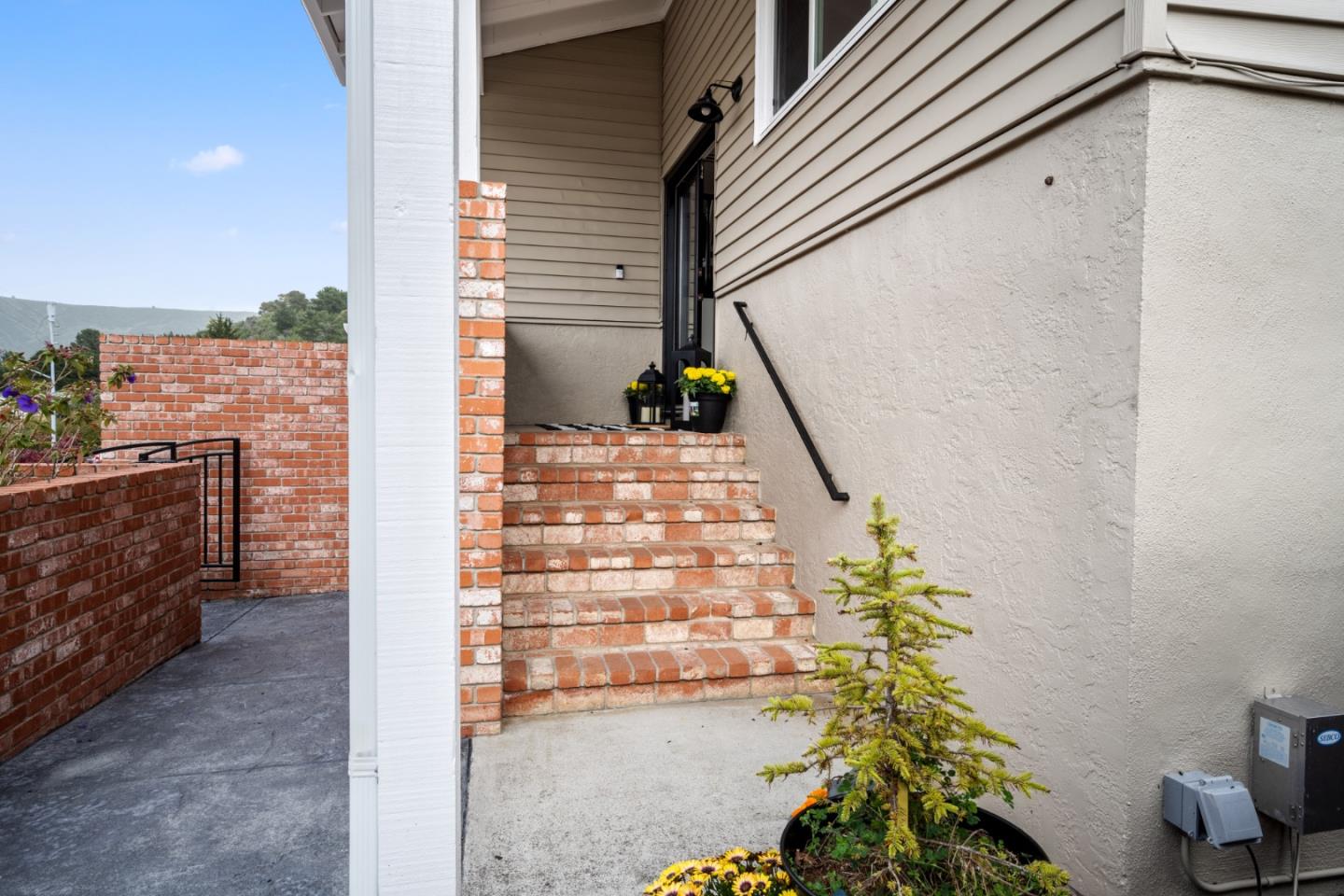 970 Park Pacifica Avenue Pacifica, CA 94044 - Photo 3 of 61 a view of a pathway along with potted plants