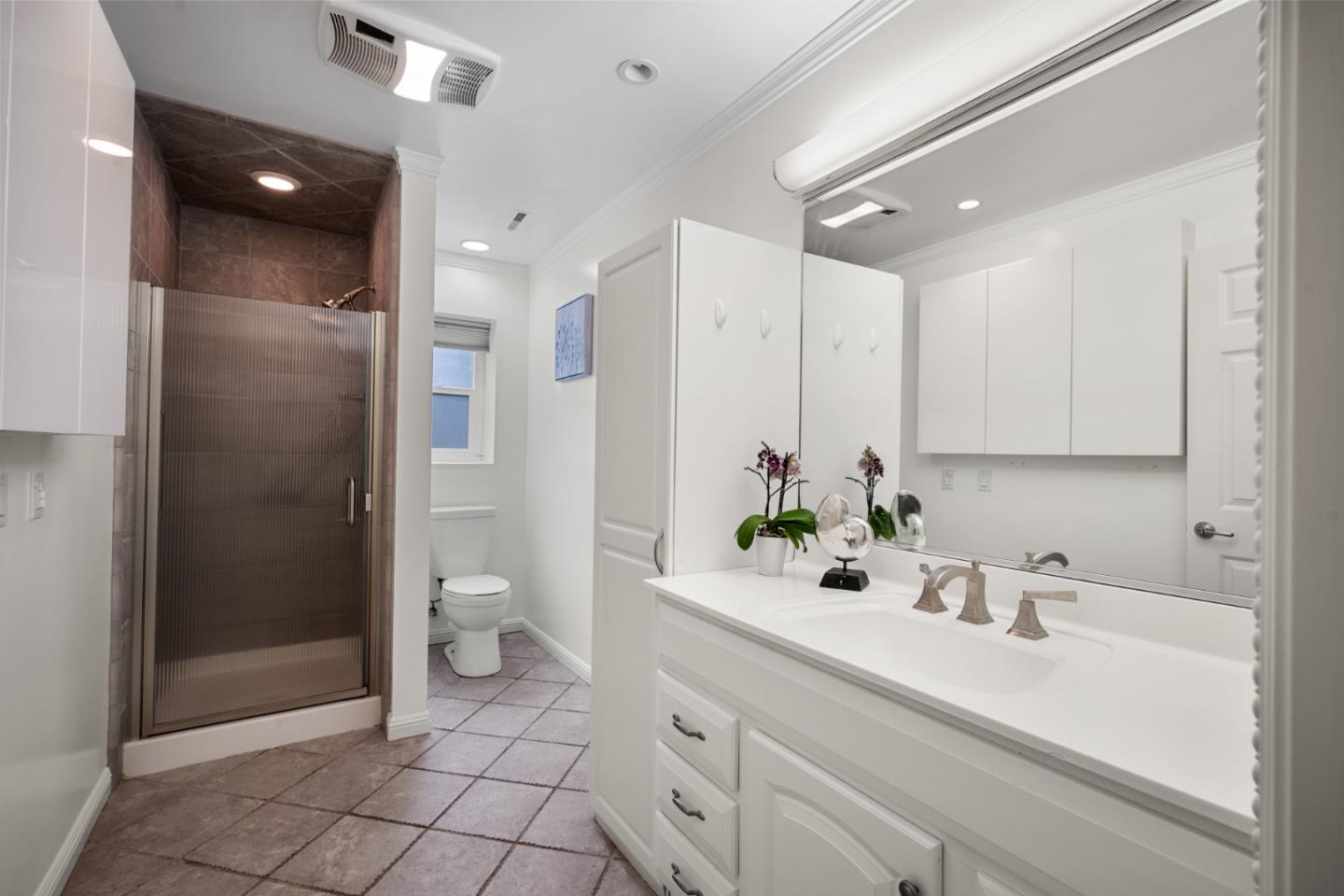 970 Park Pacifica Avenue Pacifica, CA 94044 - Photo 40 of 61 a bathroom with a double vanity sink toilet and shower