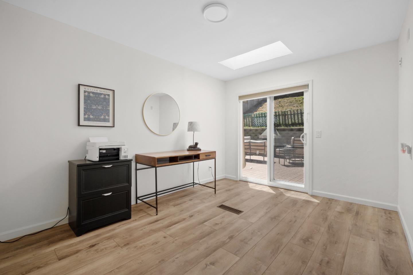 970 Park Pacifica Avenue Pacifica, CA 94044 - Photo 42 of 61 a living room with furniture and a wooden floor