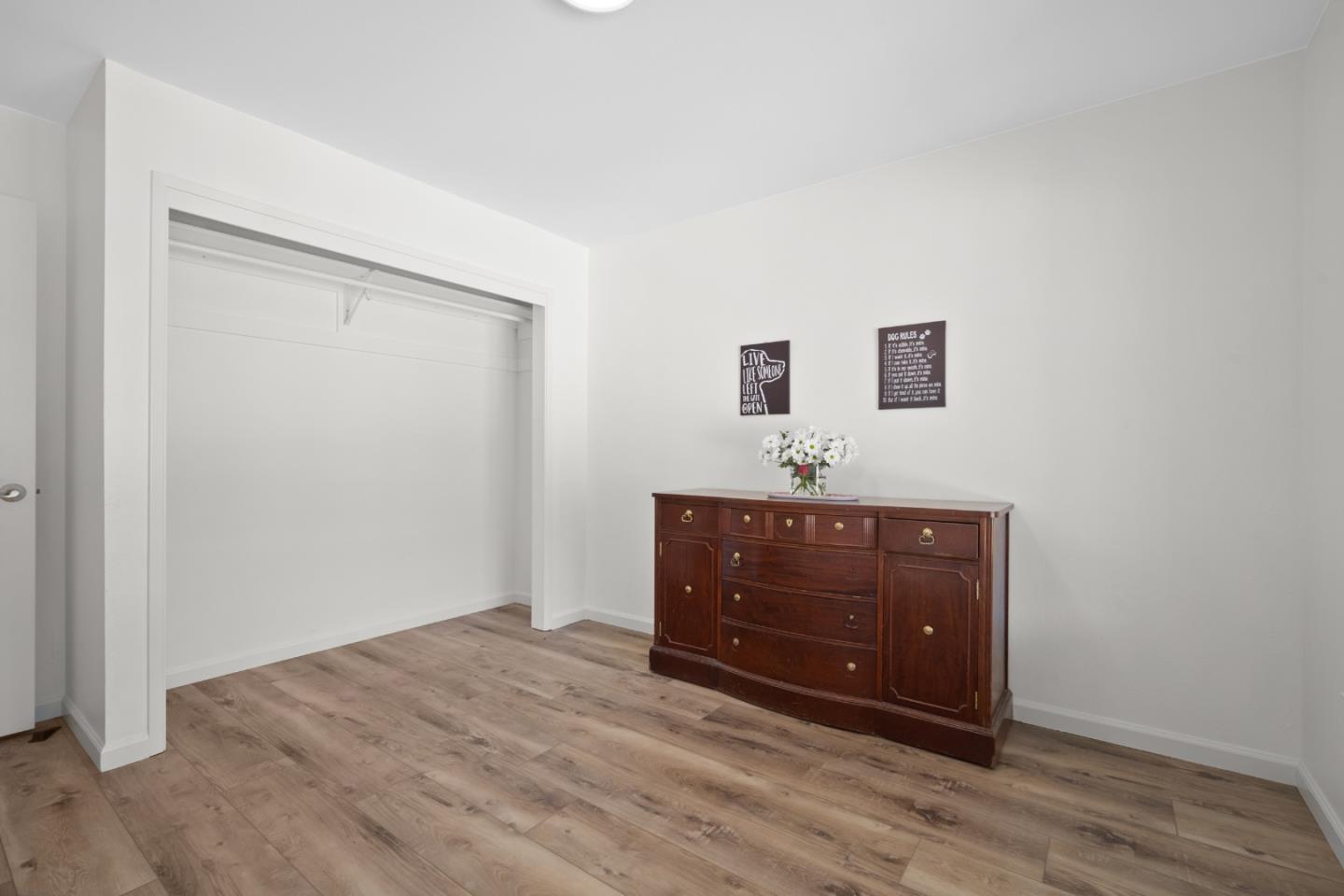 970 Park Pacifica Avenue Pacifica, CA 94044 - Photo 44 of 61 a room with a dresser and a mirror