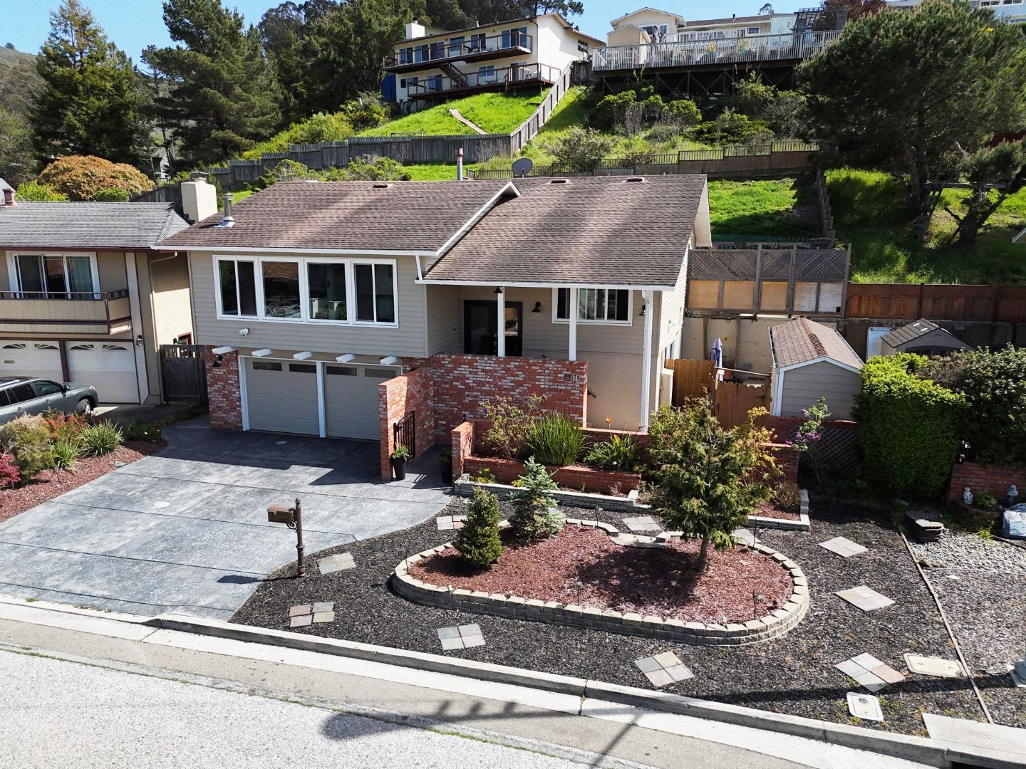 970 Park Pacifica Avenue Pacifica, CA 94044 - Photo 54 of 61 a front view of house with yard and outdoor seating