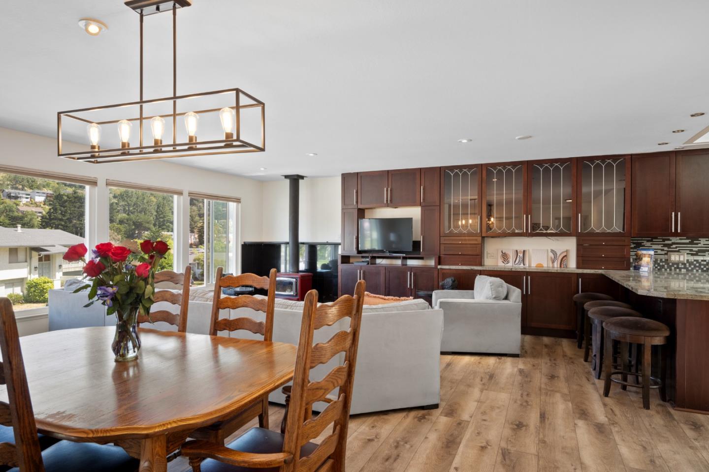 970 Park Pacifica Avenue Pacifica, CA 94044 - Photo 7 of 61 a living room with furniture kitchen view and a chandelier