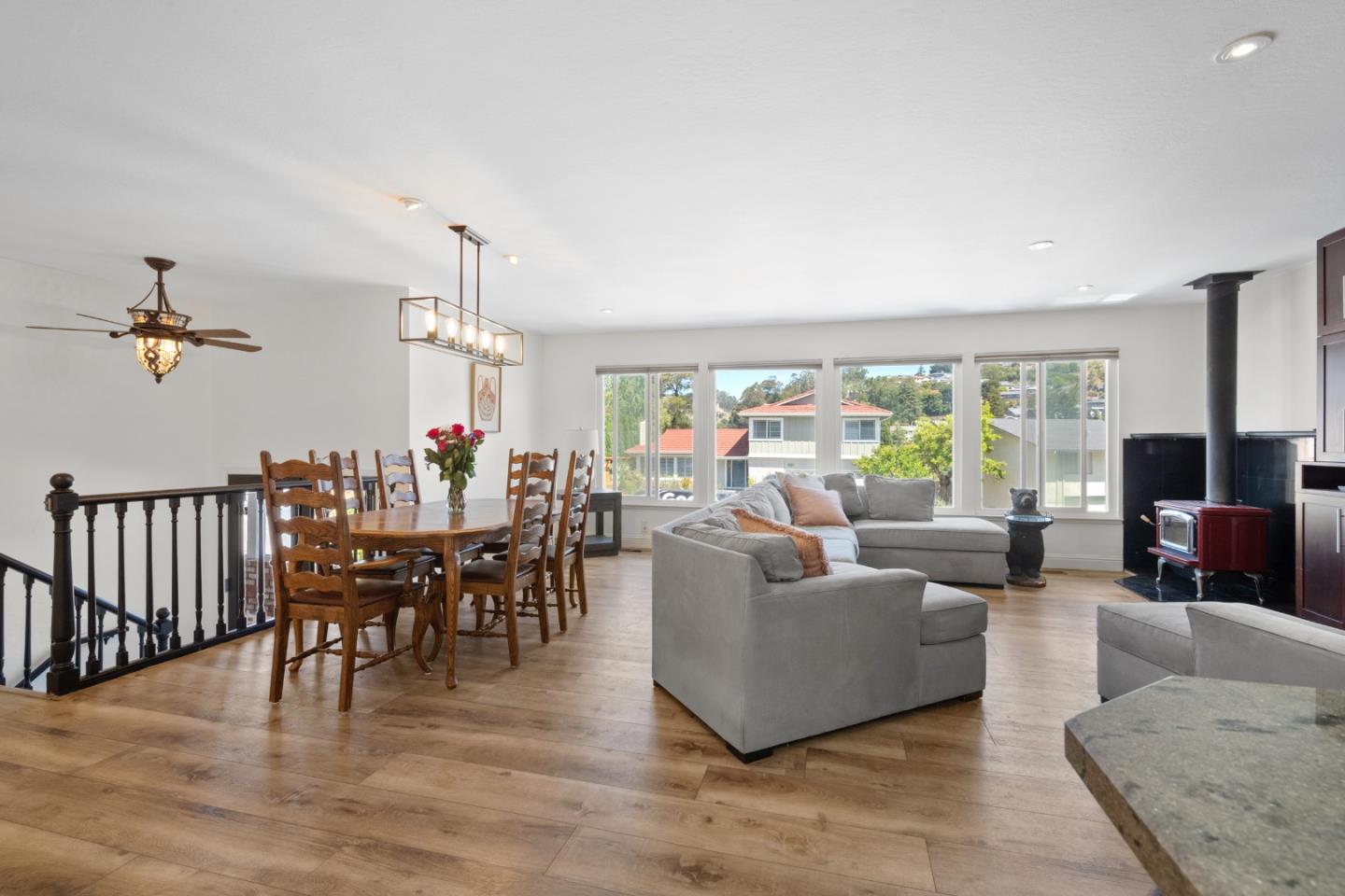 970 Park Pacifica Avenue Pacifica, CA 94044 - Photo 8 of 61 a living room with furniture dining table and a chandelier
