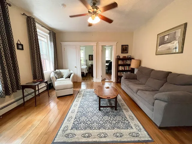 a living room with furniture and a rug