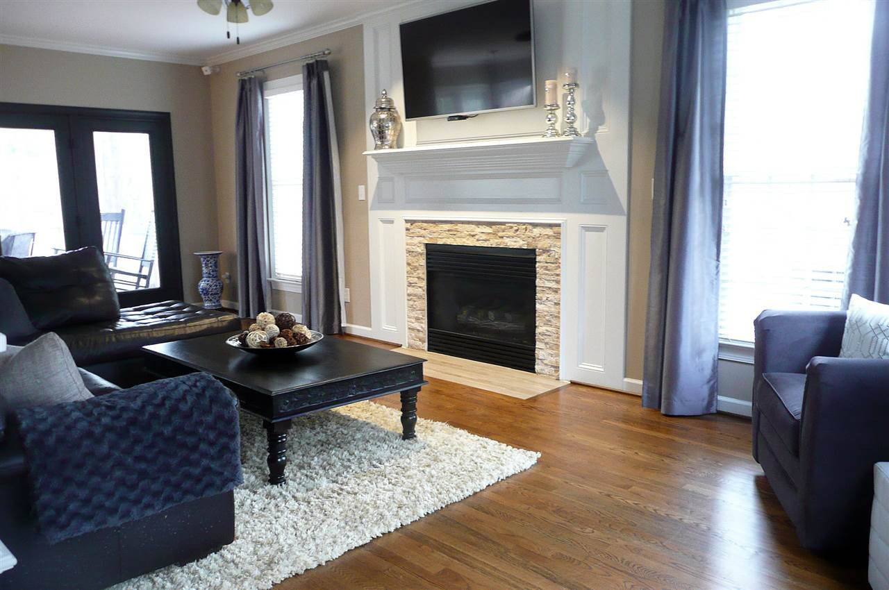 4905 Gable Ridge Lane Holly Springs, NC 27540 - Photo 7 of 25 This large family room has a gas-log fireplace with tile hearth and stone surround. This warm and inviting room is the perfect place for entertaining family and friends. Family Room With Gas-Log Fireplace