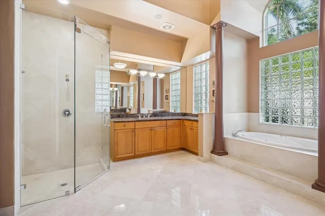 a bathroom with a double vanity sink and a bathtub