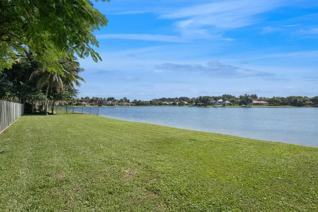 a view of a lake with houses in the background