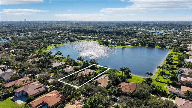 an aerial view of a house with a lake view