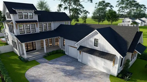 a view of a house with a yard deck and a small cabin