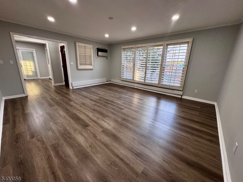 3 Fulper Place Clinton, NJ 08809 - Photo 11 of 49 an empty room with wooden floor and windows