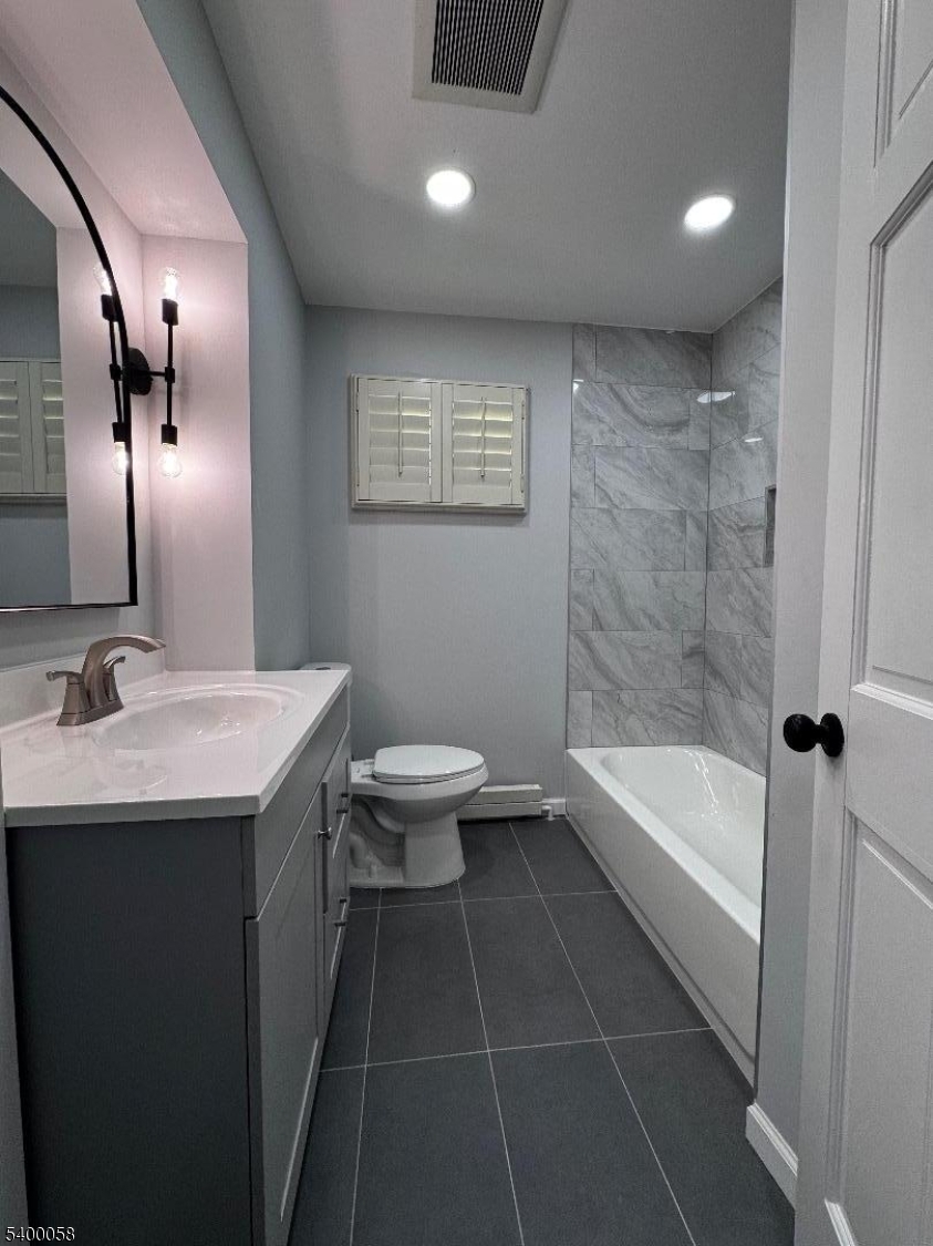 3 Fulper Place Clinton, NJ 08809 - Photo 13 of 49 a bathroom with a bathtub a sink and a toilet