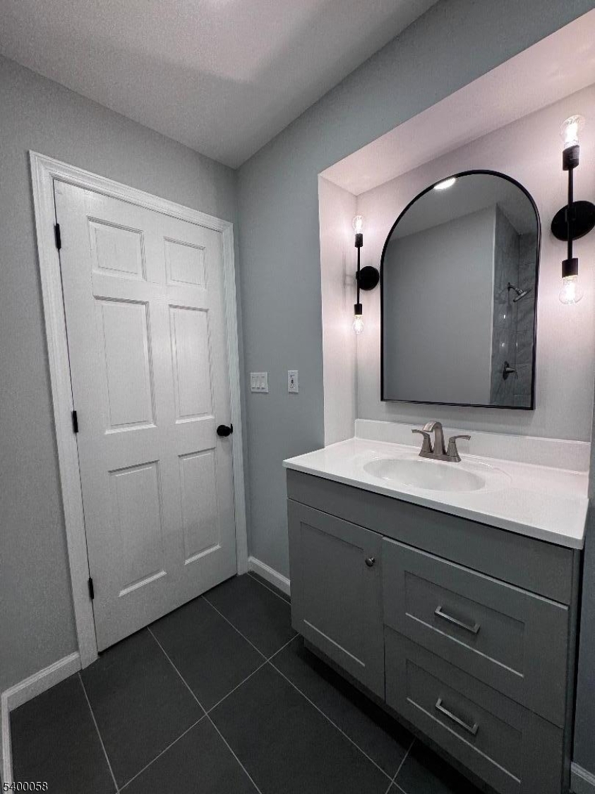 3 Fulper Place Clinton, NJ 08809 - Photo 14 of 49 a bathroom with a double vanity sink and a mirror