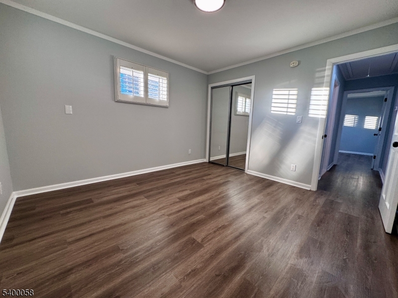 3 Fulper Place Clinton, NJ 08809 - Photo 16 of 49 a view of an empty room with wooden floor and a window