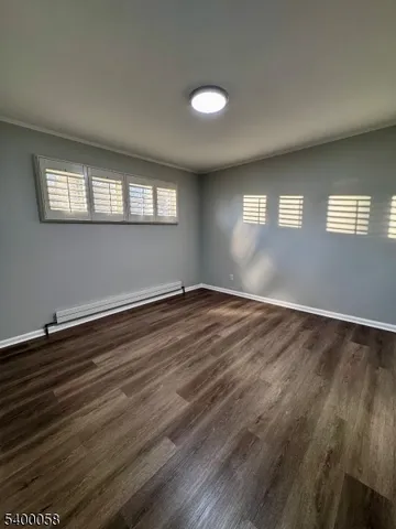 a view of a tree in front of a house