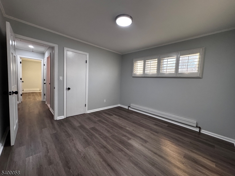 3 Fulper Place Clinton, NJ 08809 - Photo 20 of 49 an empty room with wooden floor and windows