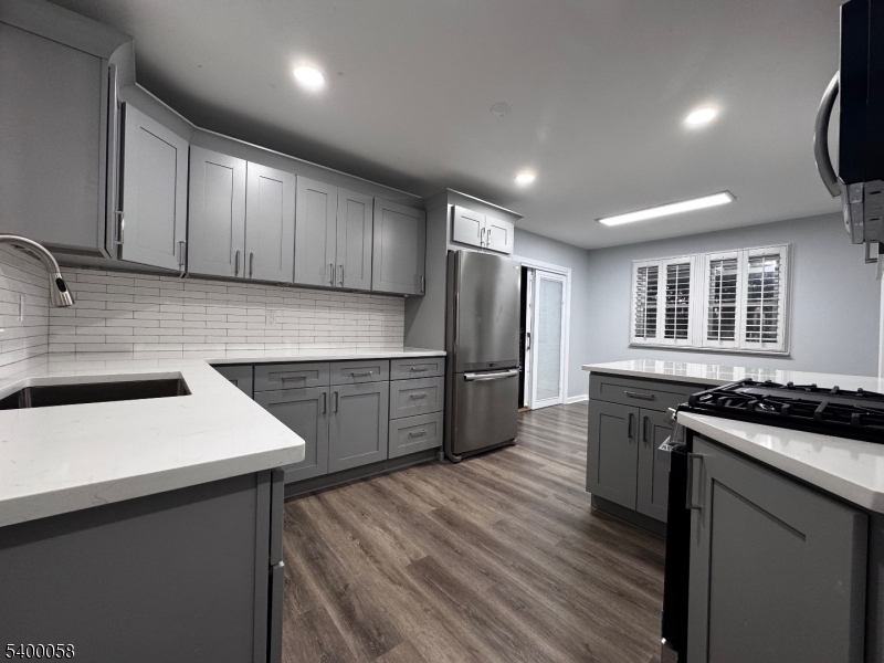 3 Fulper Place Clinton, NJ 08809 - Photo 2 of 49 a kitchen with stainless steel appliances granite countertop a sink stove and refrigerator