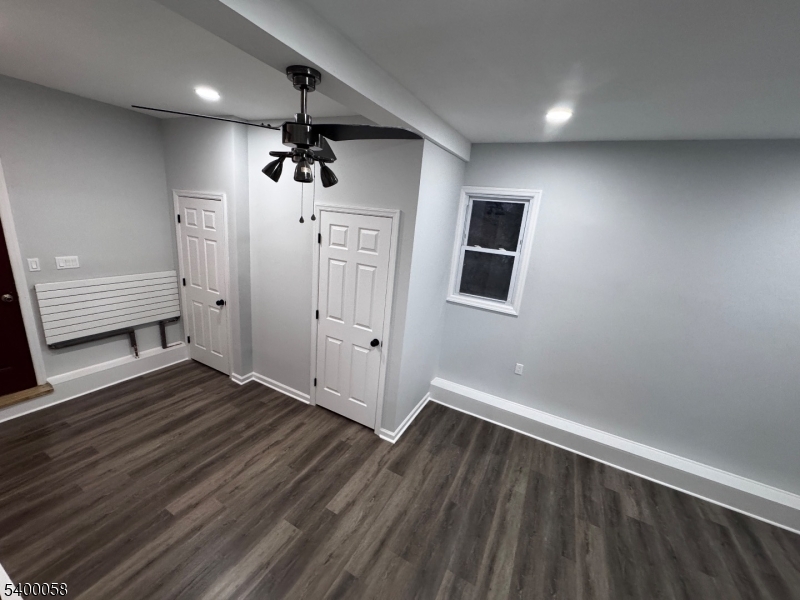 3 Fulper Place Clinton, NJ 08809 - Photo 27 of 49 a view of an empty room with wooden floor and a window