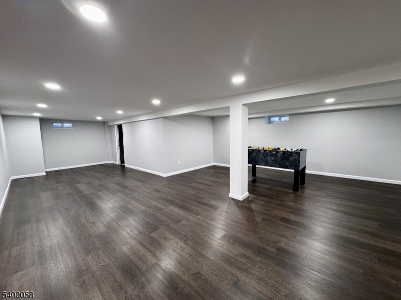 3 Fulper Place Clinton, NJ 08809 - Photo 37 of 49 a view of an empty room with wooden floor and piano