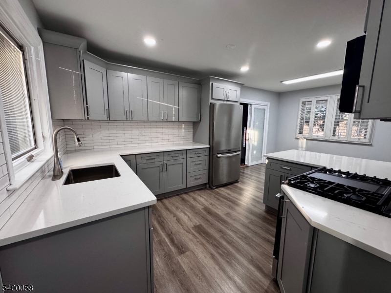 3 Fulper Place Clinton, NJ 08809 - Photo 5 of 49 a kitchen that has a sink wooden cabinets and stainless steel appliances