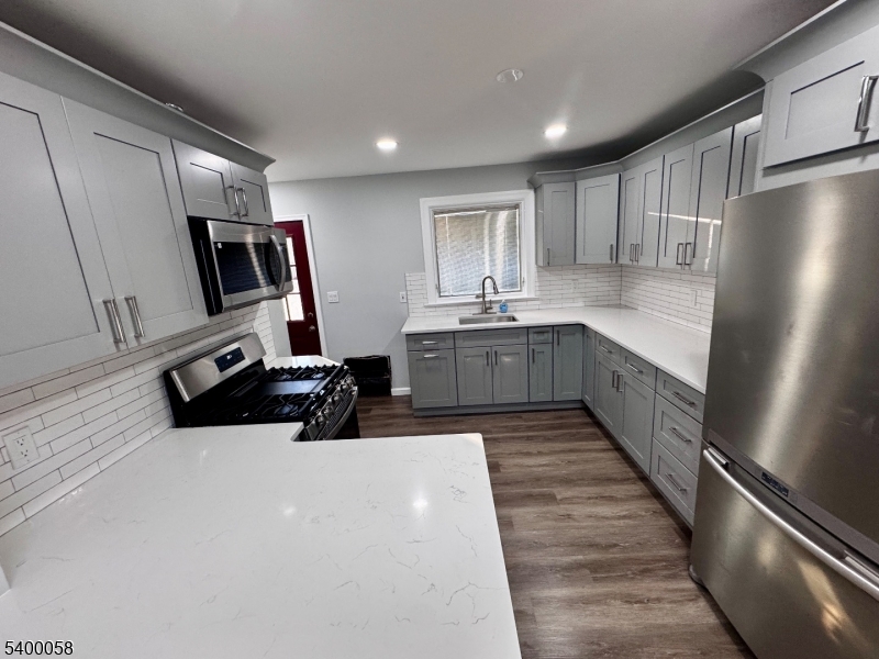 3 Fulper Place Clinton, NJ 08809 - Photo 6 of 49 a kitchen with stainless steel appliances a refrigerator sink and microwave