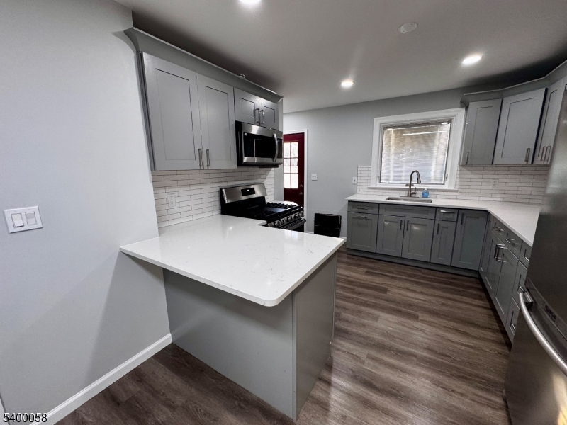 3 Fulper Place Clinton, NJ 08809 - Photo 7 of 49 a kitchen with kitchen island sink stove and refrigerator