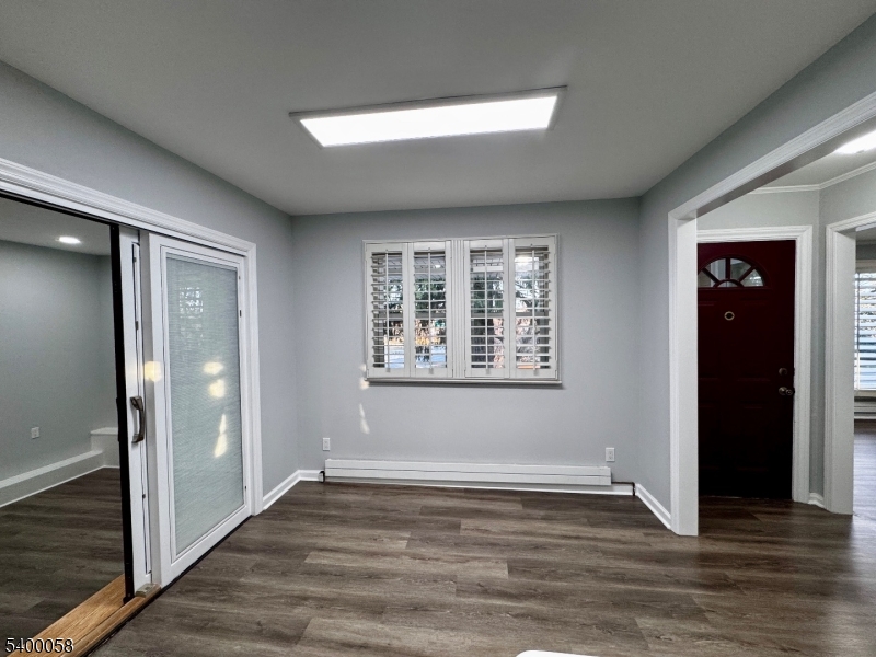 3 Fulper Place Clinton, NJ 08809 - Photo 9 of 49 an empty room with wooden floor and windows