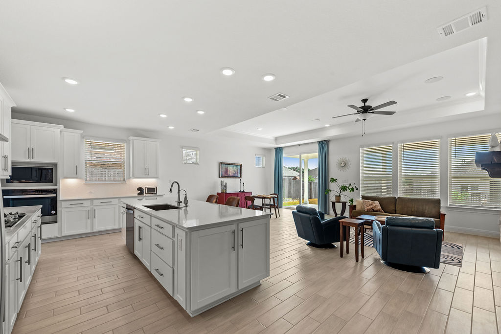 279 Fish Trap Road Dripping Springs, TX 78620 - Photo 13 of 36 The open concept living space here is simple and clean.