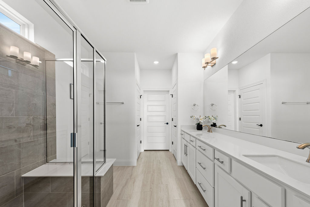 279 Fish Trap Road Dripping Springs, TX 78620 - Photo 17 of 36 Primary bathroom facing the water closet, primary walk-in closet, and linen closet.