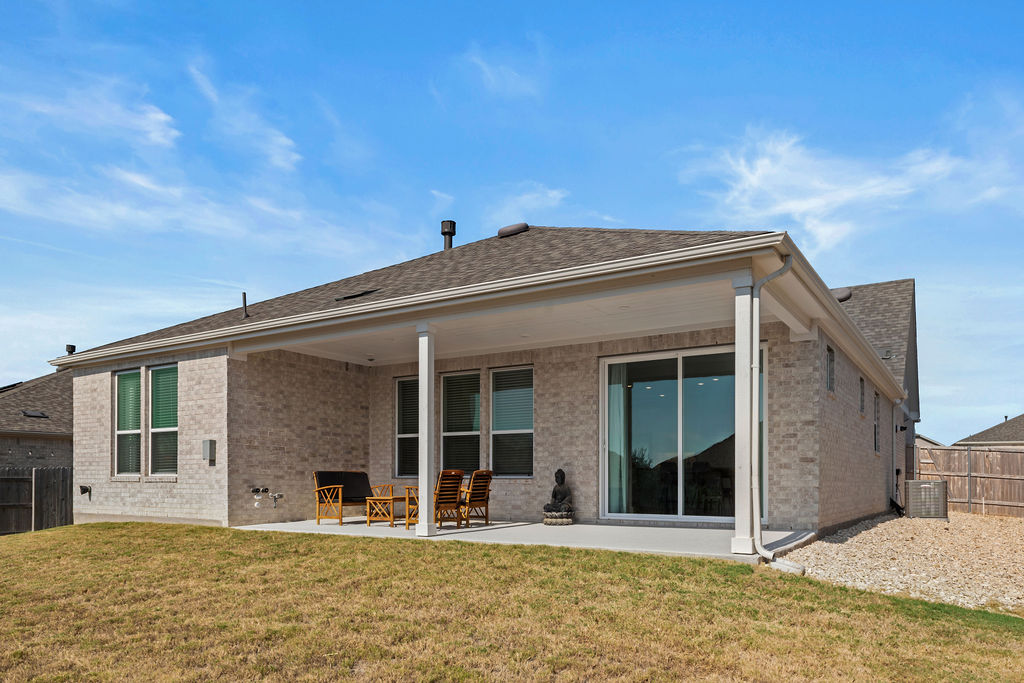 279 Fish Trap Road Dripping Springs, TX 78620 - Photo 27 of 36 The back patio is large and features a gas line for a grill.