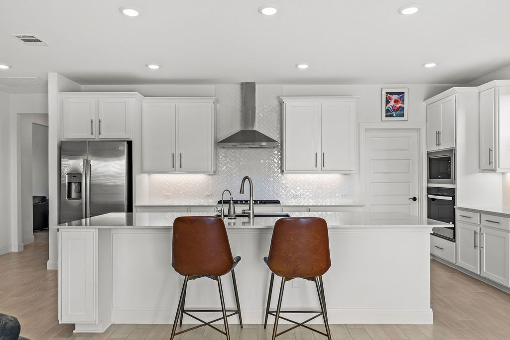 279 Fish Trap Road Dripping Springs, TX 78620 - Photo 9 of 36 Reverse osmosis drinking water at the sink and under counter lighting are additional upgrades.