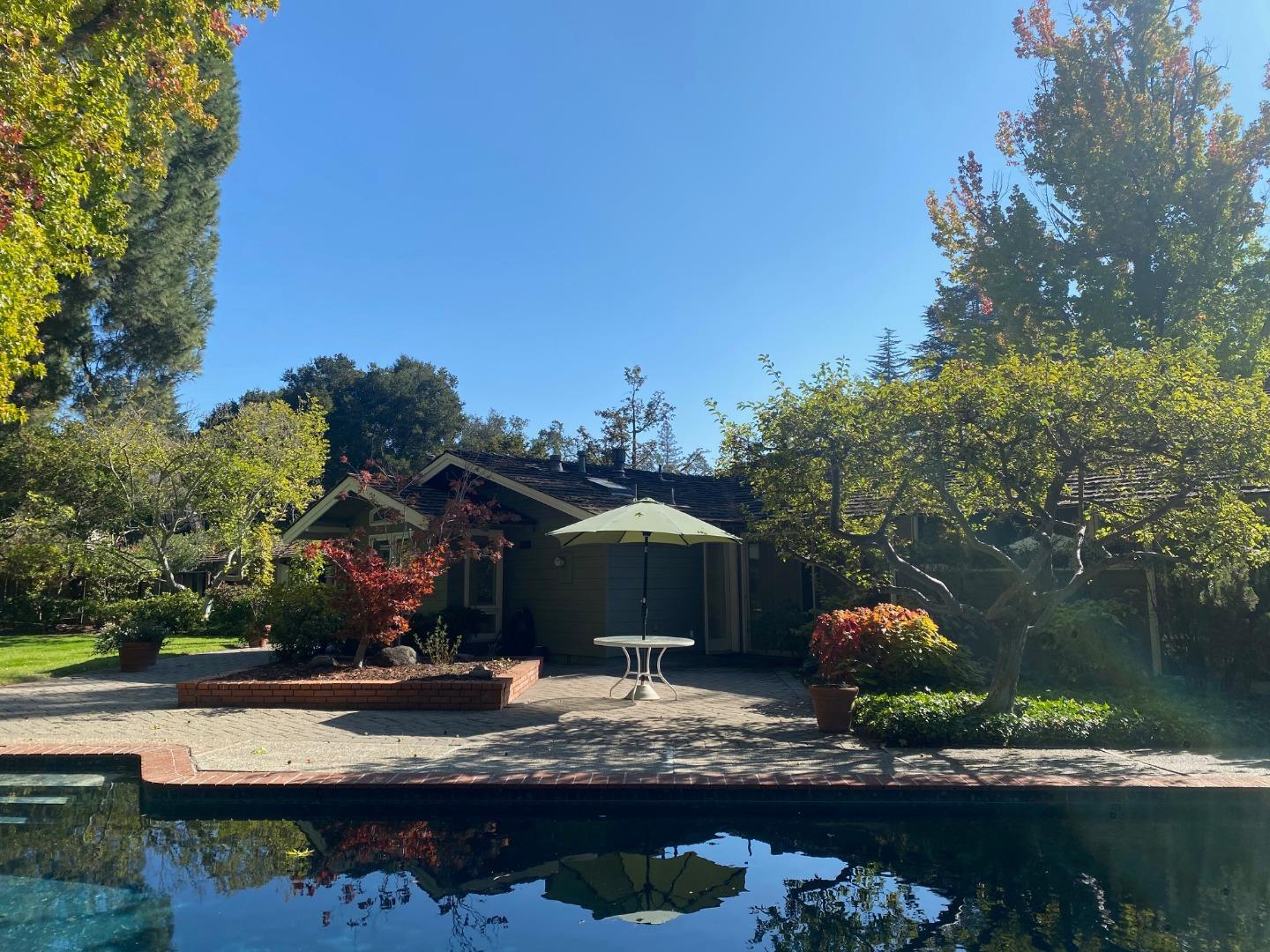 59 James Avenue Atherton, CA 94027 - Photo 2 of 4 a view of house with yard entertaining space and outdoor seating