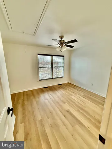 a view of an empty room and a window