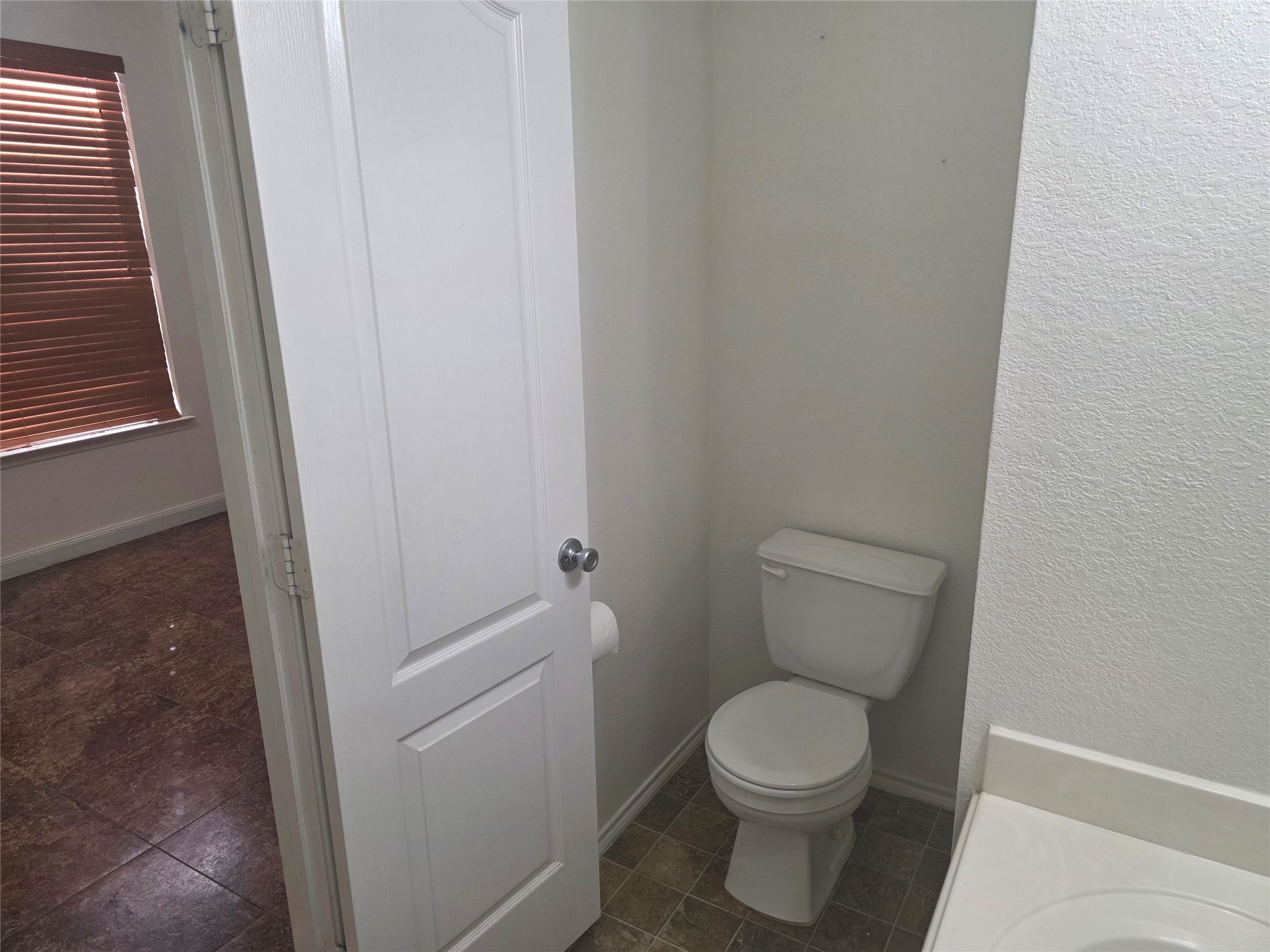 12062 Bach Orchard Trail Houston, TX 77038 - Photo 12 of 20 a white toilet sitting next to a sink