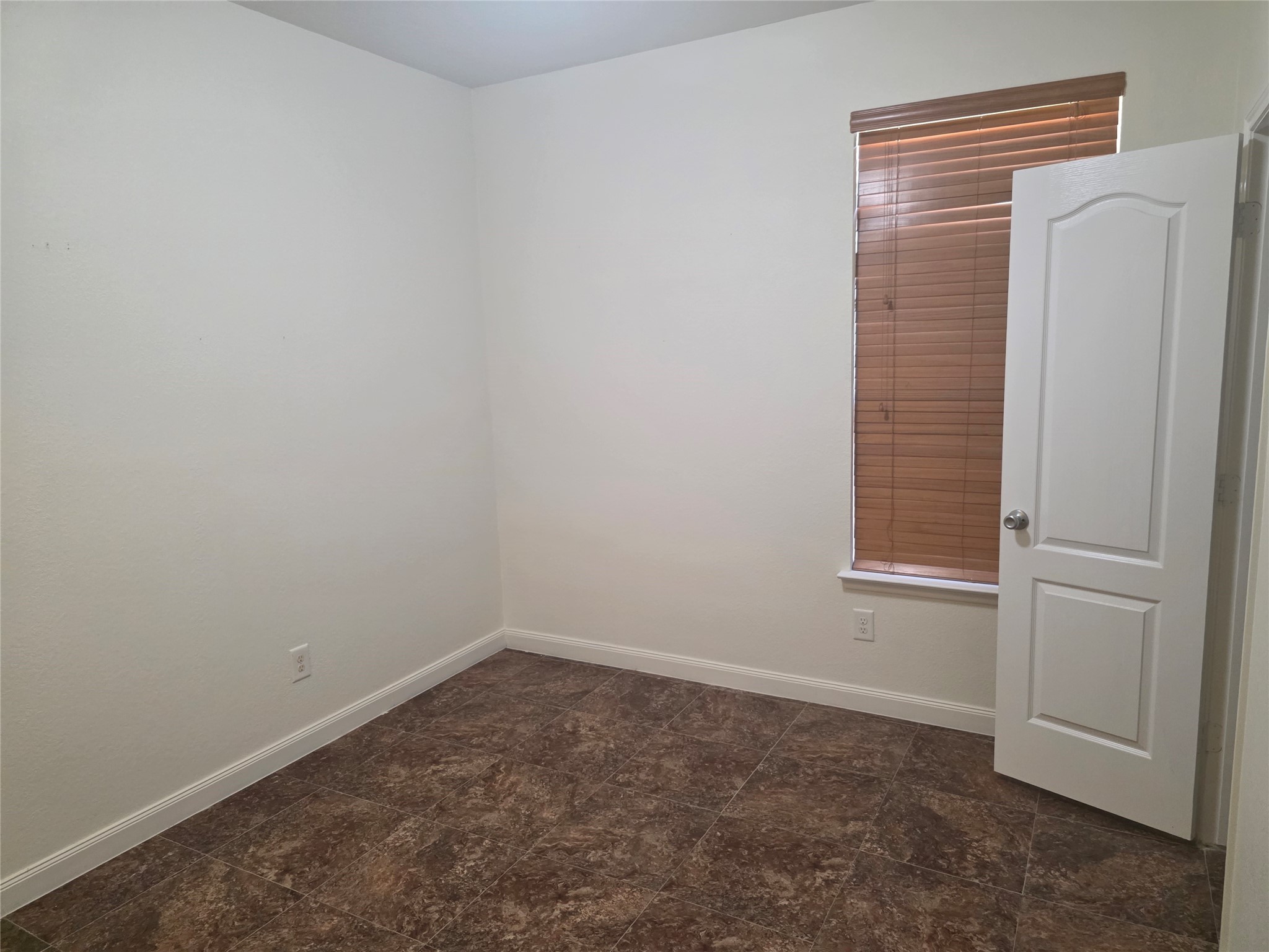 12062 Bach Orchard Trail Houston, TX 77038 - Photo 17 of 20 an empty room with a window