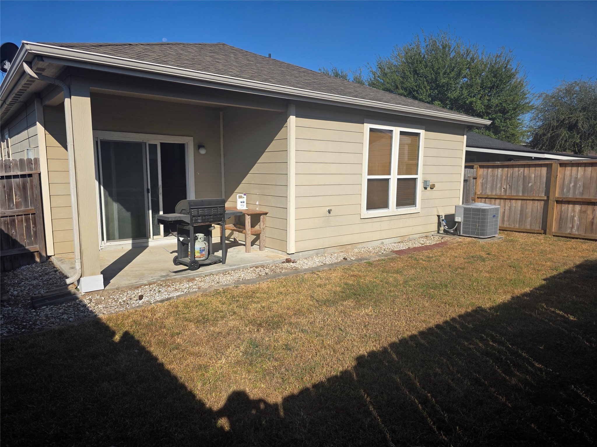 12062 Bach Orchard Trail Houston, TX 77038 - Photo 19 of 20 a view of a house with backyard and sitting area