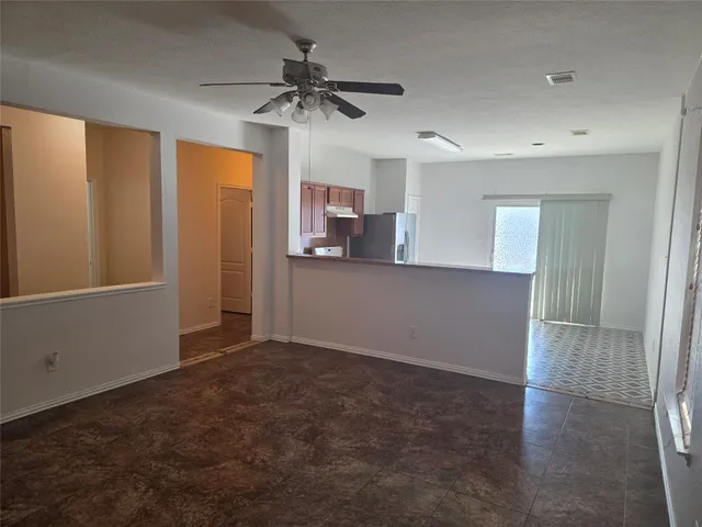 a view of a kitchen with a sink and cabinet area