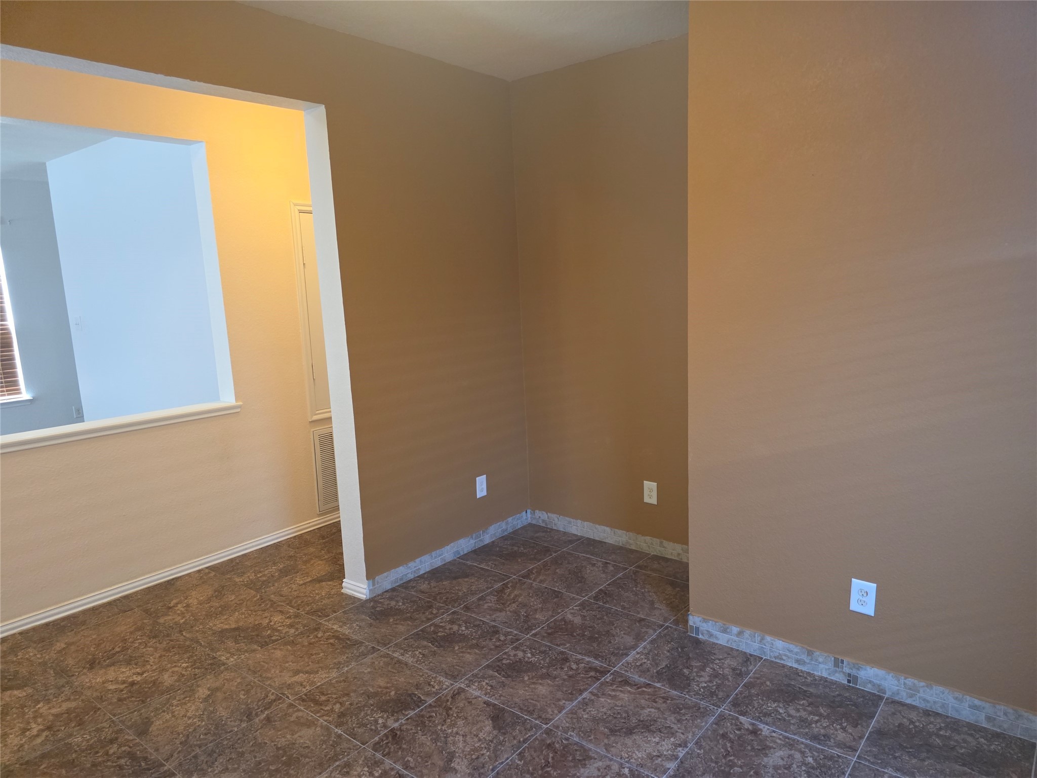 12062 Bach Orchard Trail Houston, TX 77038 - Photo 9 of 20 a view of an empty room with windows and entrance